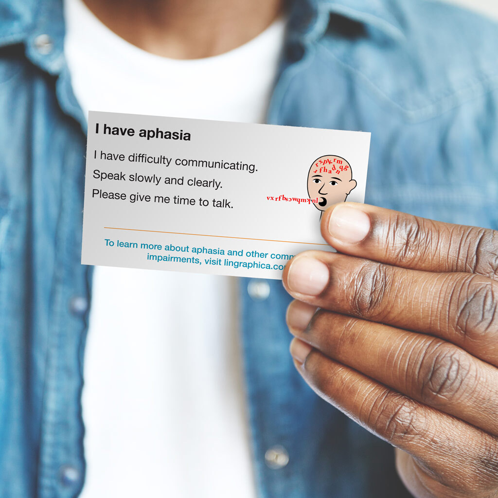 Image of man holding a communication ID card