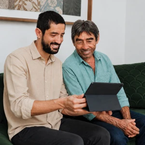 man-using-aac-device-to-communicate